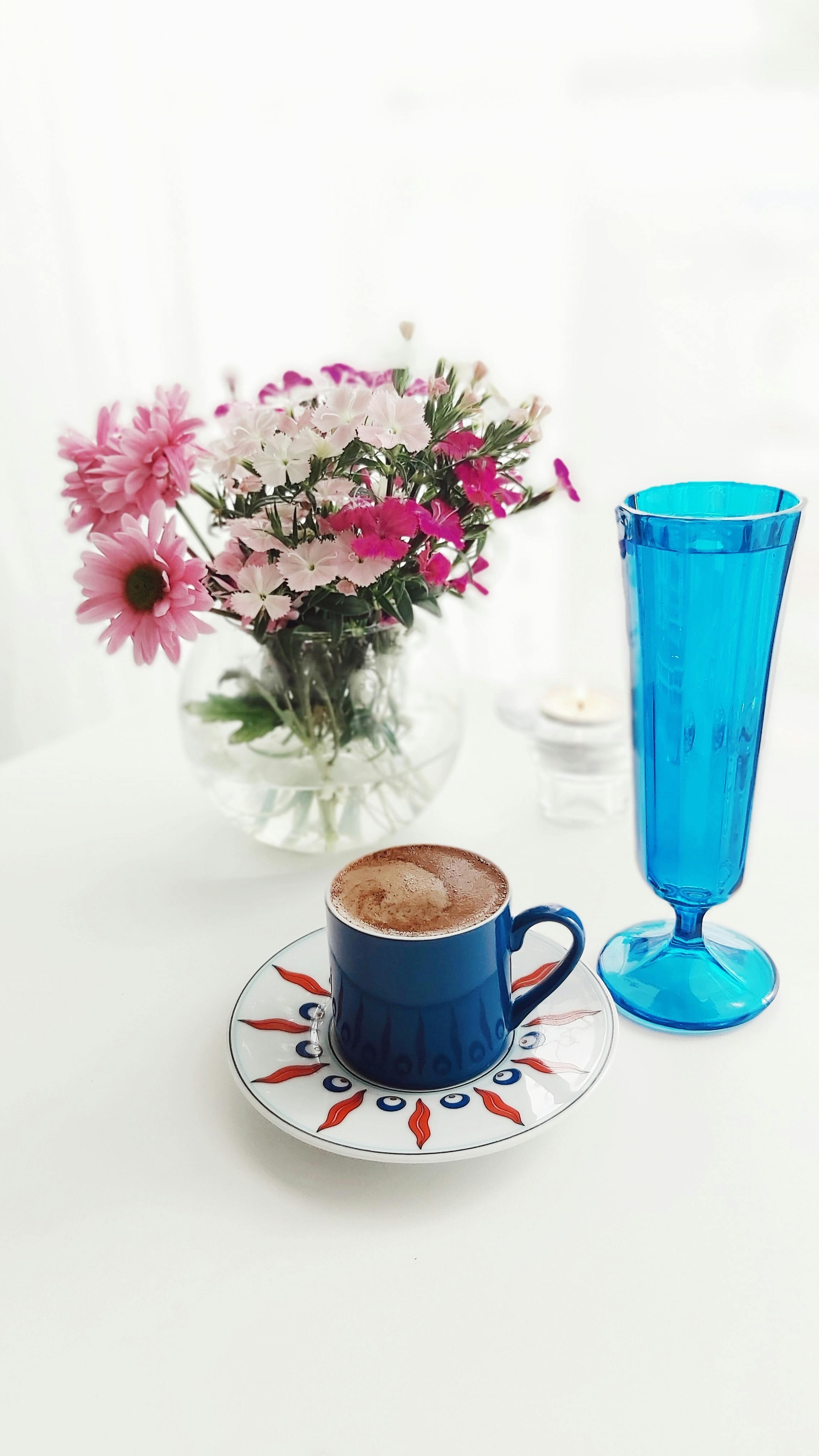 Coffee in Mug and Flowers in Vase · Free Stock Photo