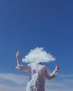 Head in Cloud with Blue Sky in Background
