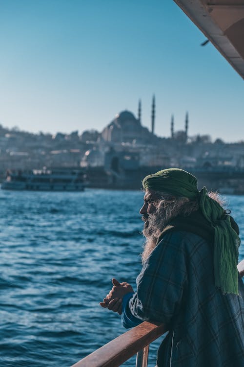 Man with Long Beard on the Railings by the Sea