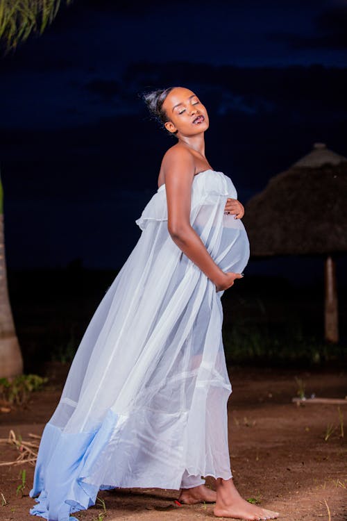 Free Pregnant Woman in White Dress Stock Photo