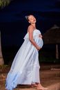Pregnant Woman in White Dress