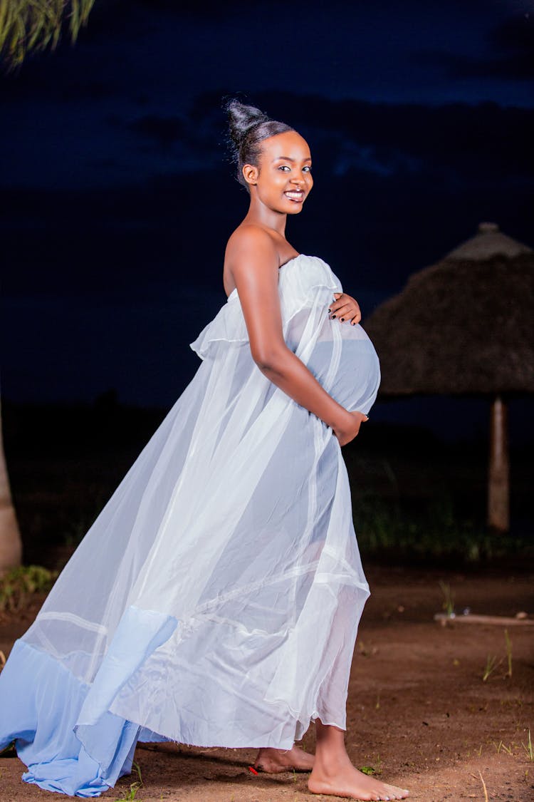 Pregnant Woman In White Long Dress