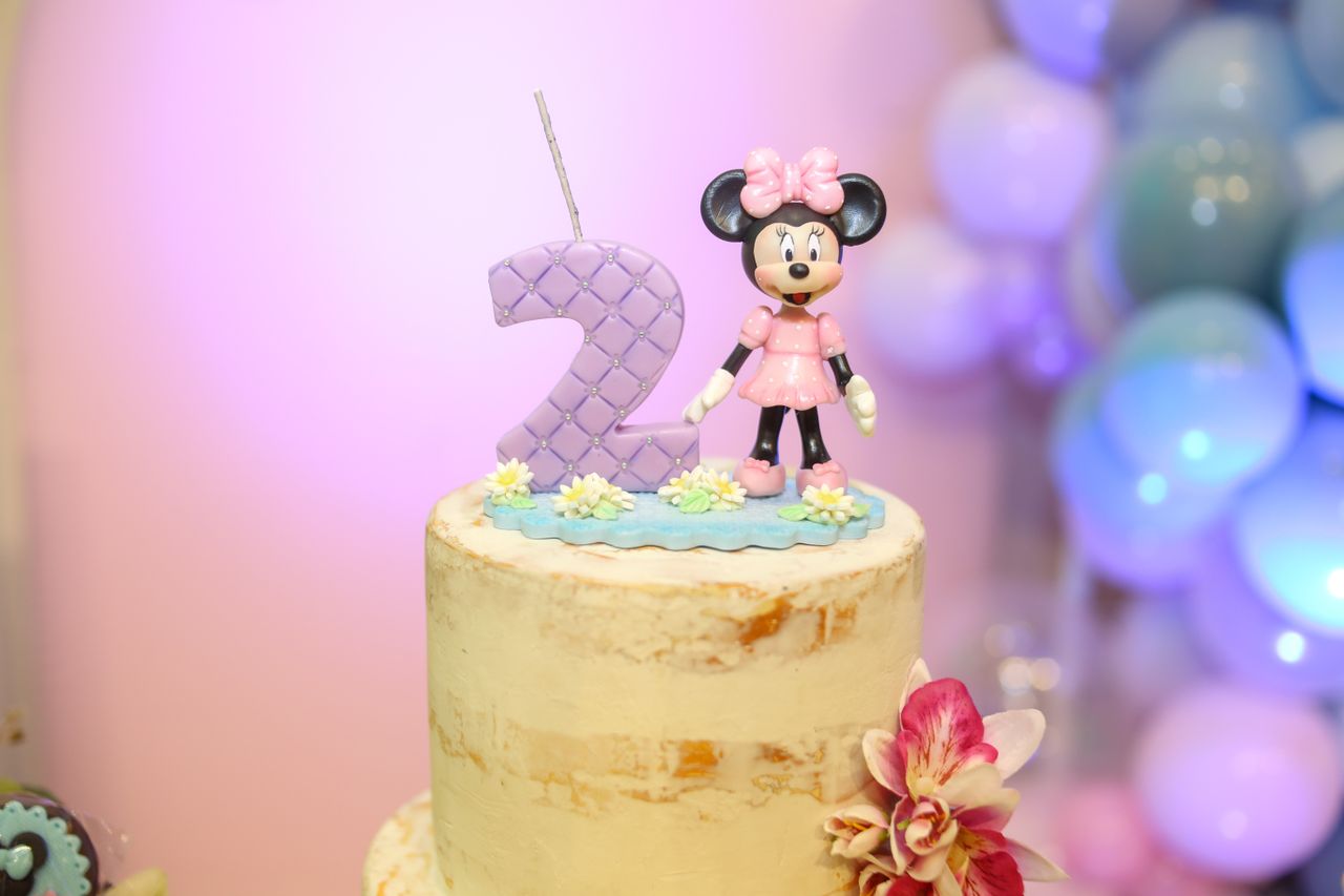 delightful birthday cake featuring minnie mouse and number two topper
