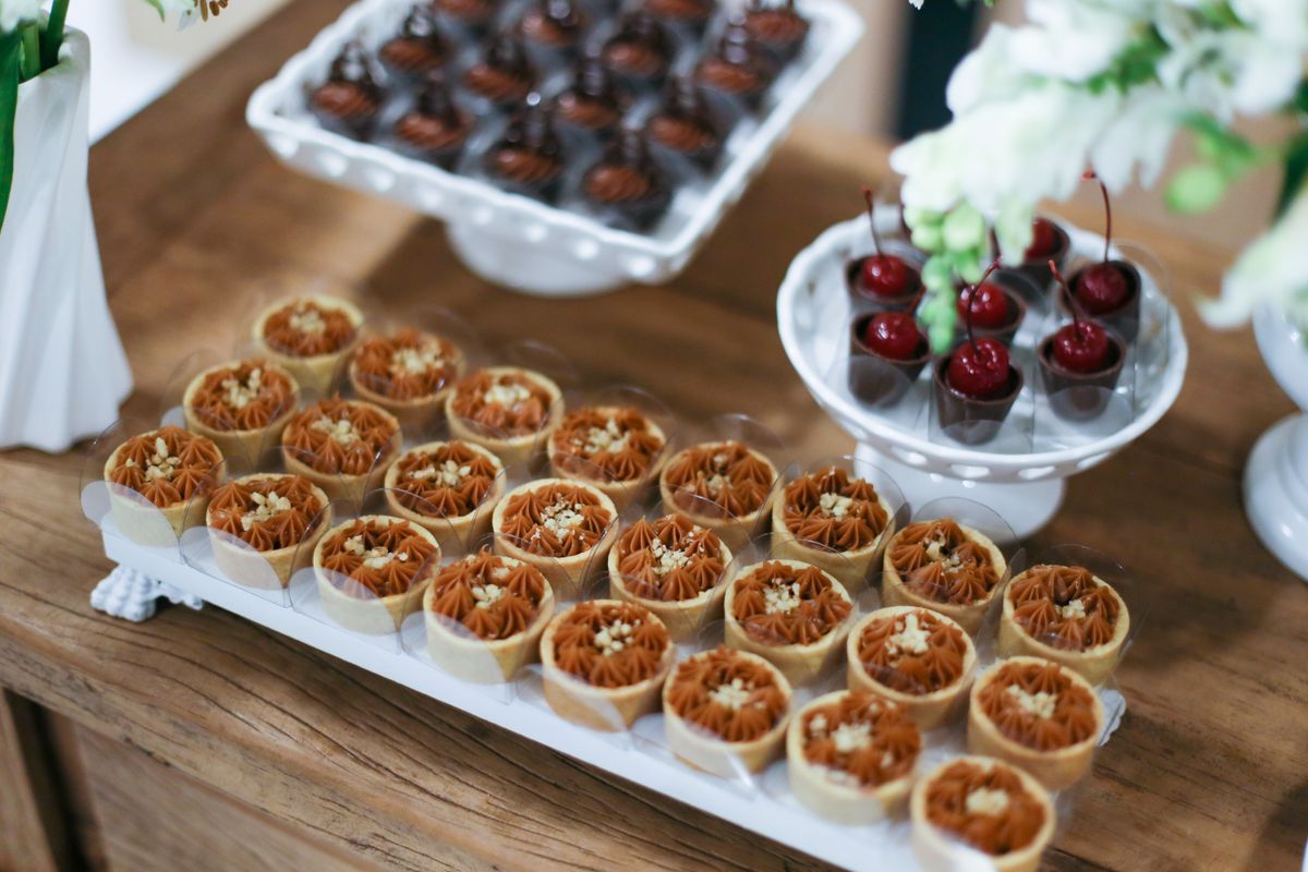Baby shower dessert table ideas with a tiered cupcake stand