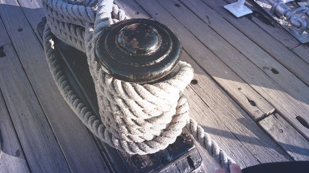 White Rope Tied on Black Steel Bar