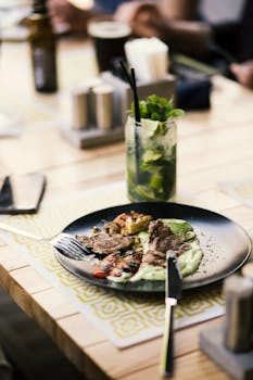 Round Black Plate With Silver Steel Bread Knife