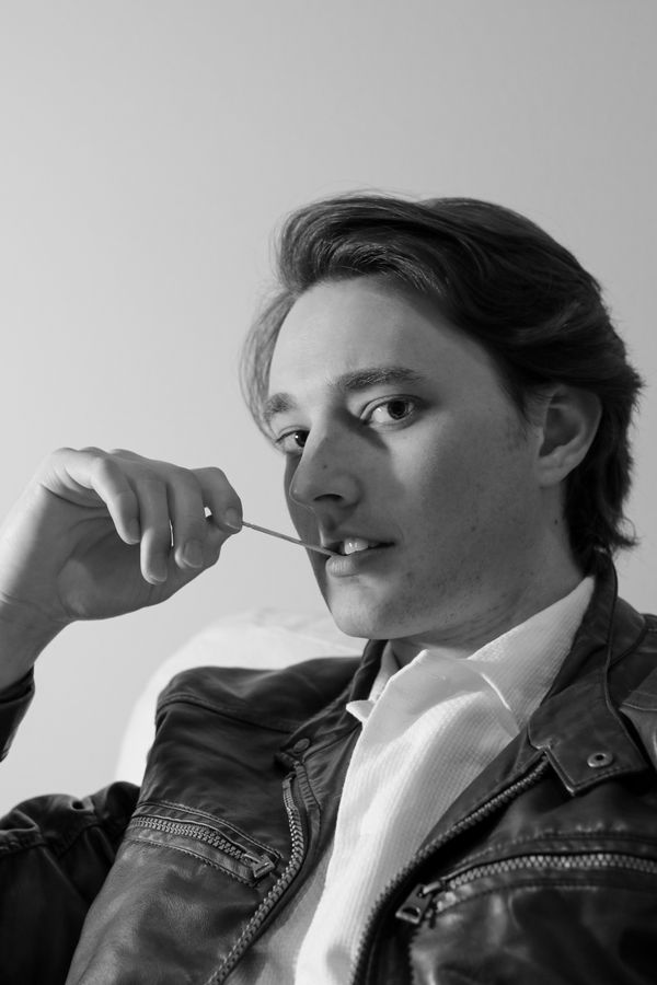 Black and white portrait of a musician in a leather jacket — photo by Talal Hakim on Pexels