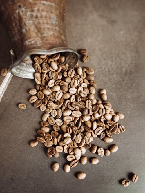 Brown Coffee Beans on Black Surface