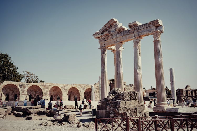 People Looking At Temple Of Apollo