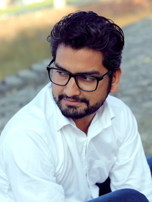 Close-up of a Man with Beard Wearing Eyeglasses