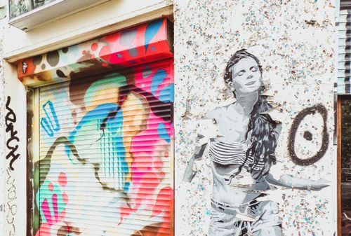 Free Dynamic street art and graffiti on an urban wall in Berlin, showcasing bold colors and artistic styles. Stock Photo