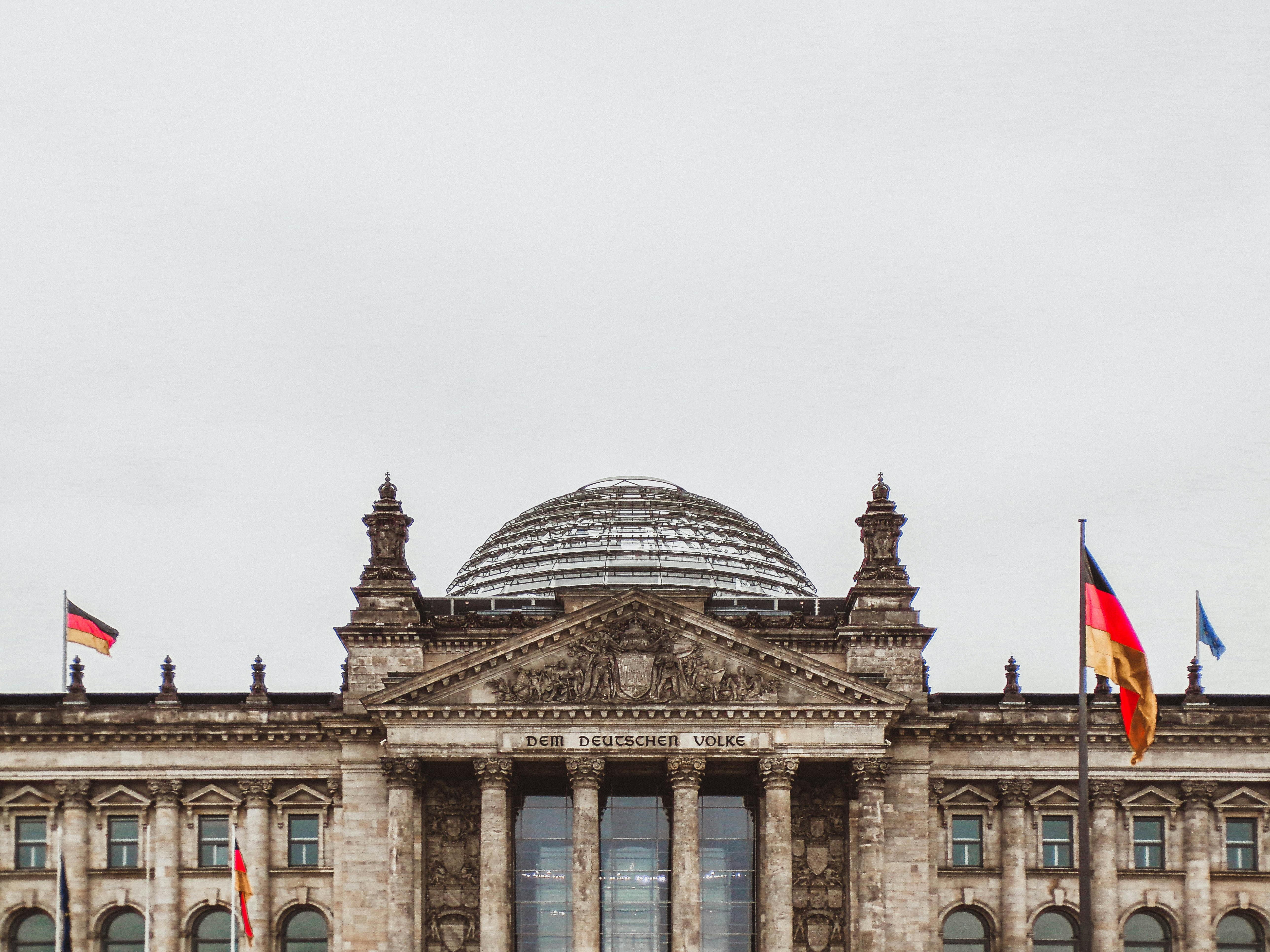 Dramatic orange-red sunset sky with striking clouds, symbolizing a warming atmosphere