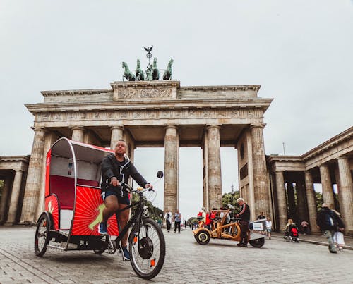 Free Man in Black Hoodie Riding Trike Stock Photo