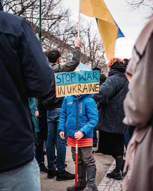 Free A Kid Protesting against the War in Ukraine Stock Photo