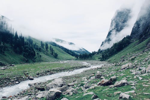 River Between Mountains With Fogs