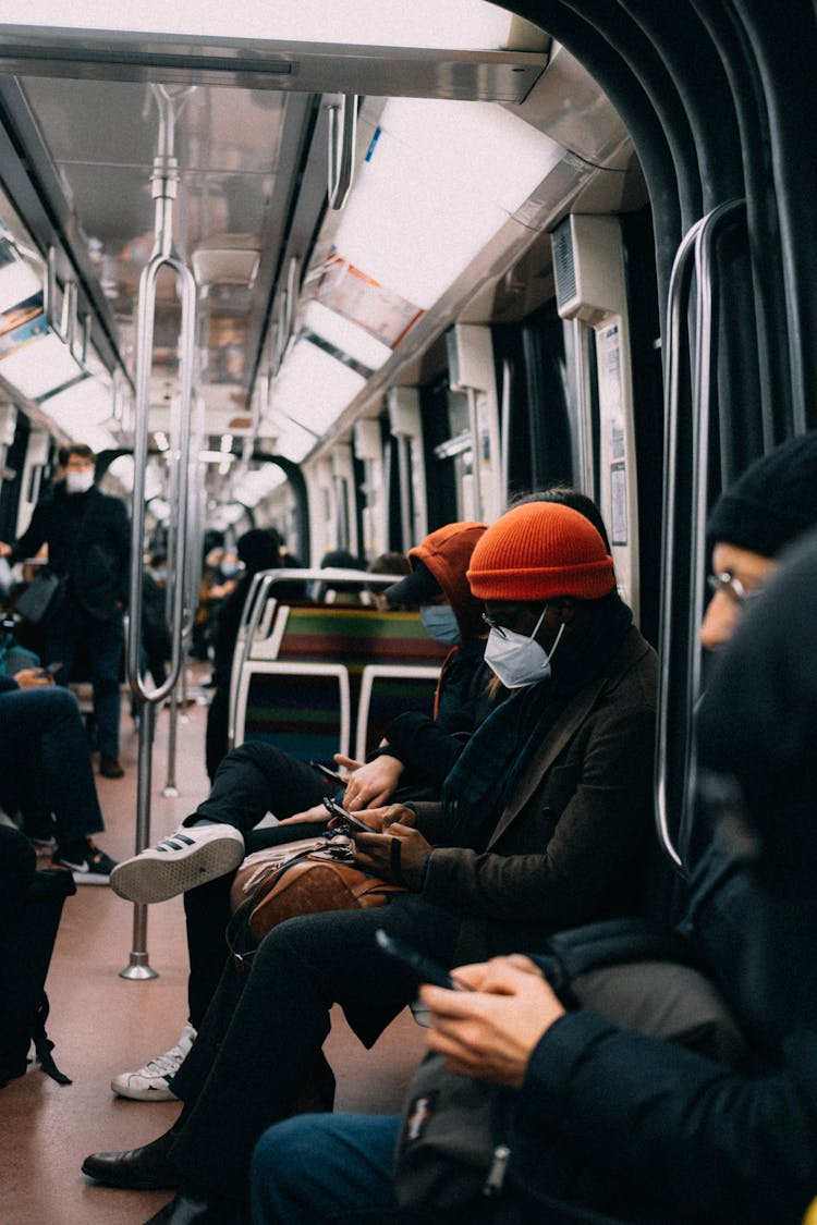 People Sitting In Subway 