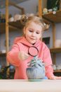Girl in Pink Long Sleeve Shirt Holding White and Red Bird Plush Toy