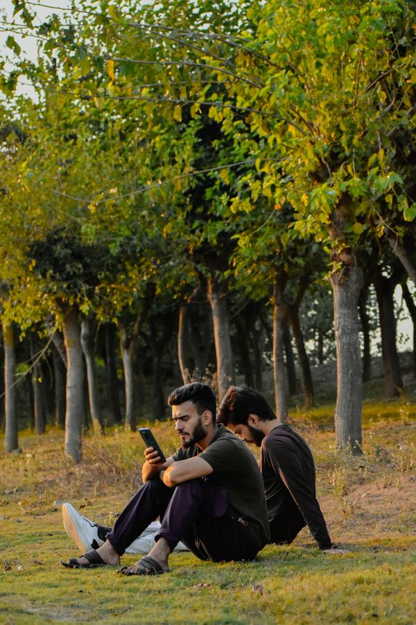 Men in Pakistan on phones