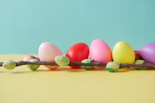 Colored Eggs on Yellow Surface 