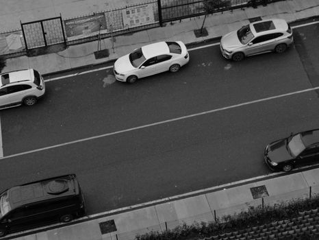 White Coupe on Road in Grayscale Photography