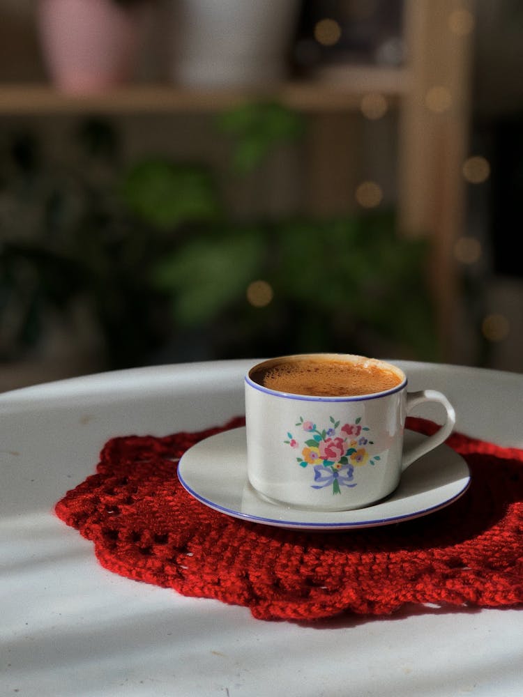 A Coffee In A Cup On A Red Crochet Coaster