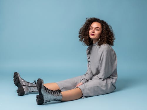 Free Curly Haired Woman Sitting Stock Photo