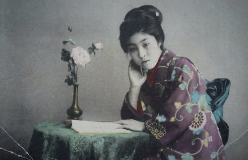 Young Japanese Woman Reading Book