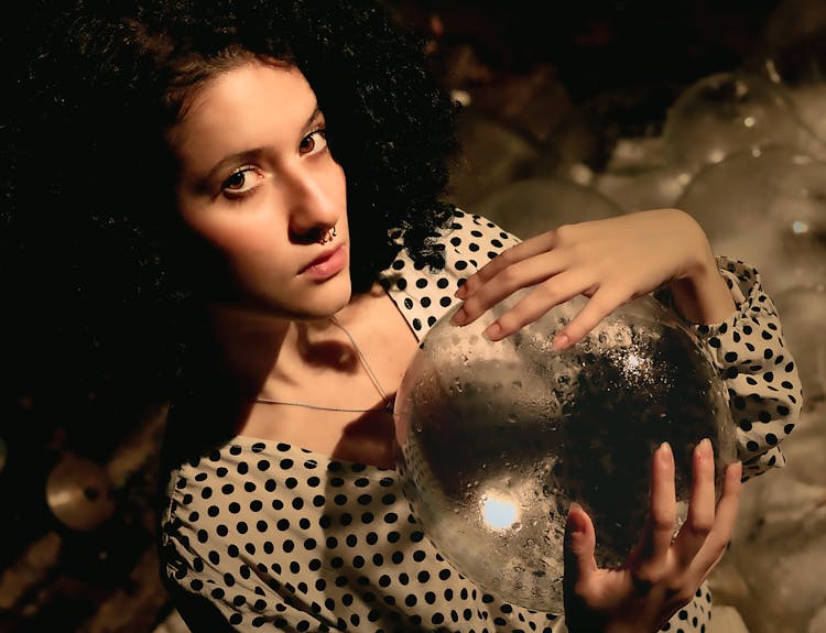 Portrait Of Woman Holding Ice Sphere