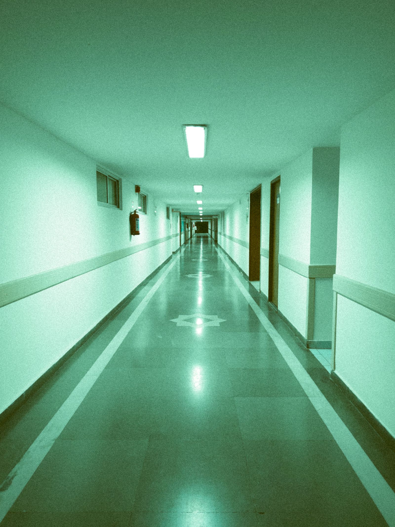 A wide, well-lit hospital corridor