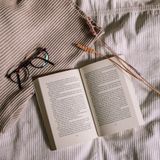 Open journal on sand-coloured linen — photo by Evi on Pexels