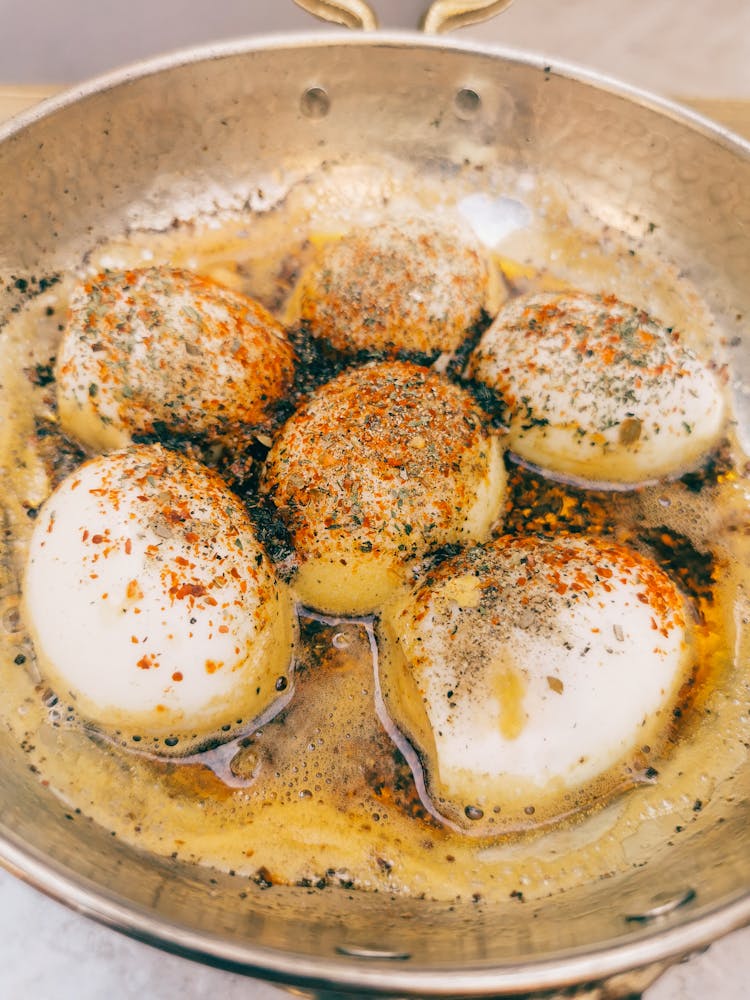 Eggs With Spices On A Pan 