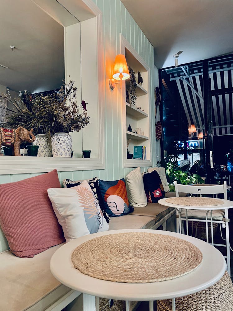 Cozy Bench With Pillows In Cafe