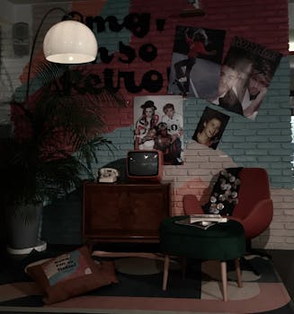 A cozy retro living room with vintage TV, posters, and colorful brick wall.