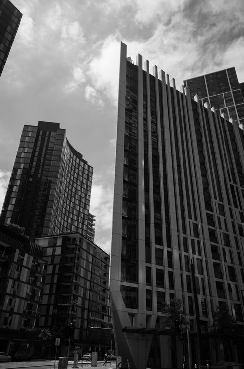 Free Black and white photo of modern skyscrapers in an urban downtown, showcasing contemporary architecture. Stock Photo