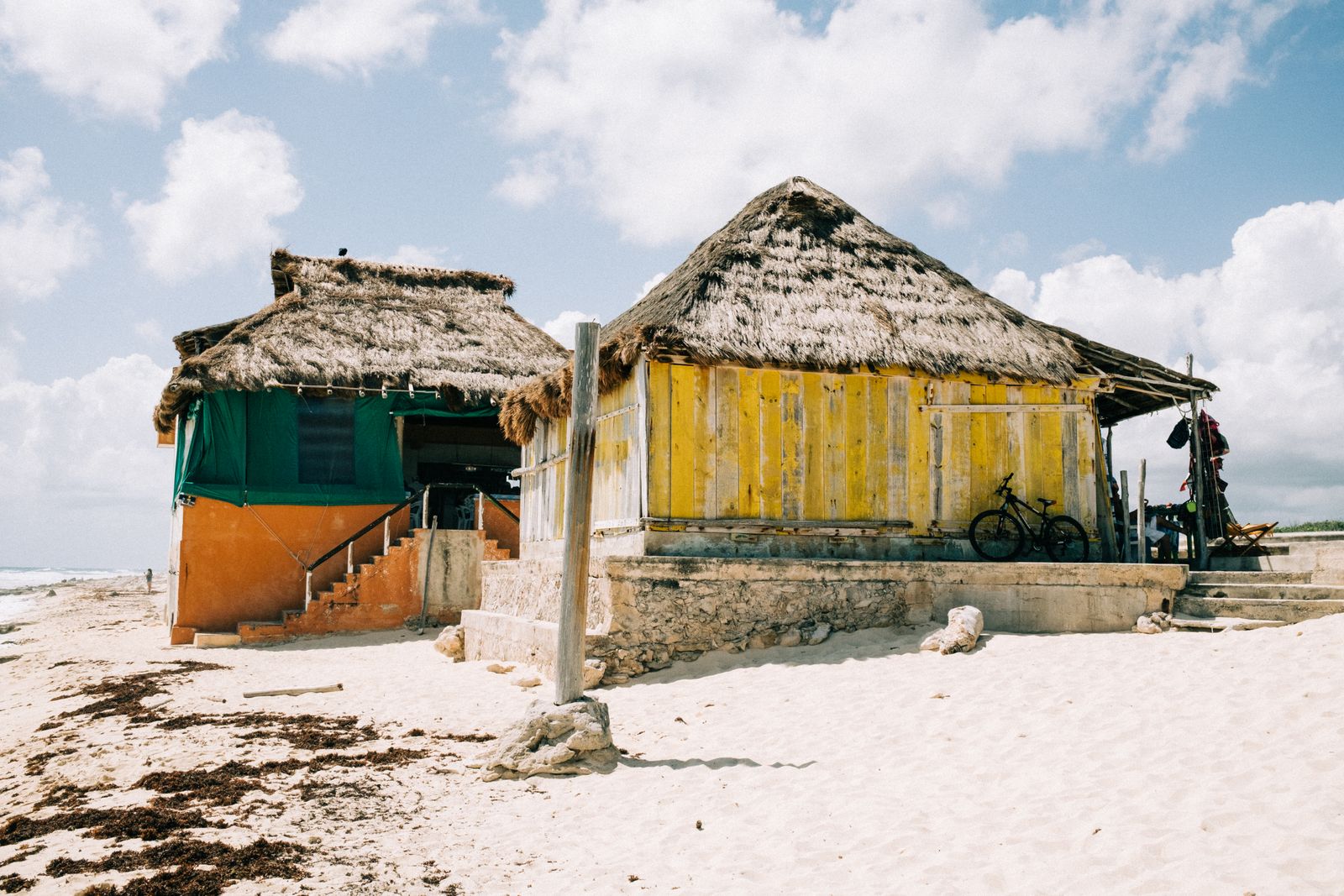 Coastal outdoor shelter beside a sandy beach