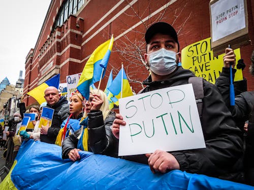 Free People in the Street Protesting against the War in Ukraine   Stock Photo