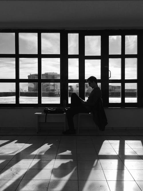 Man Sitting by the Window