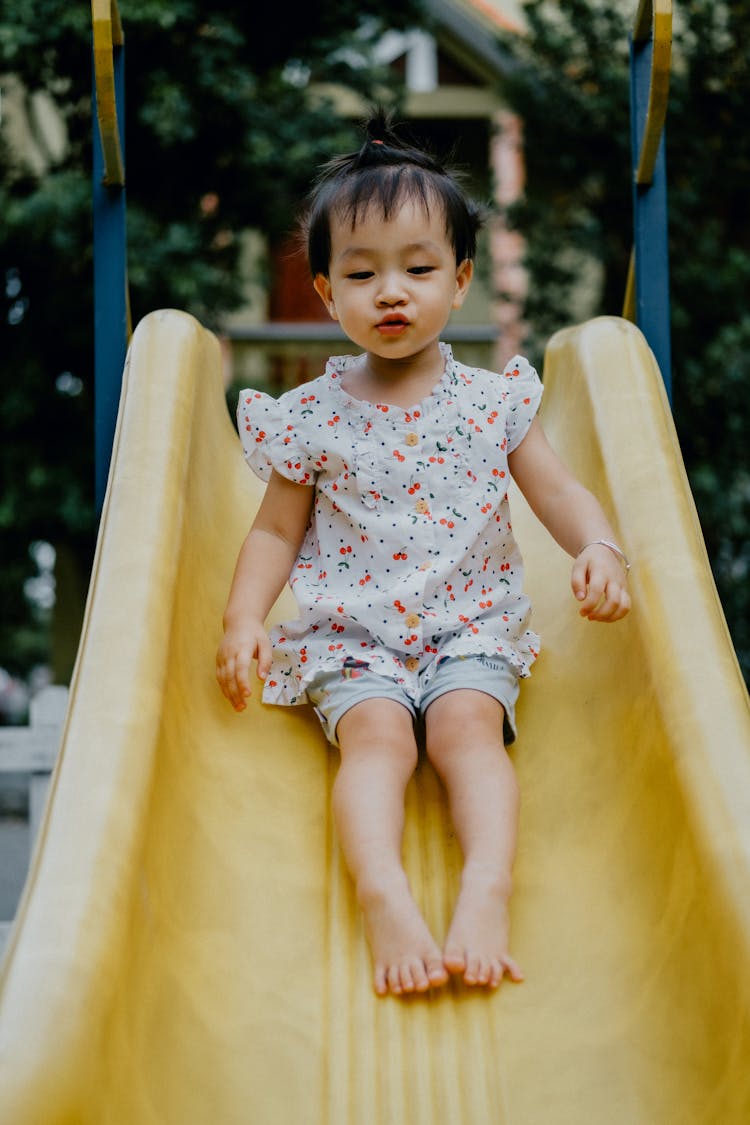 Little Girl On The Slide 