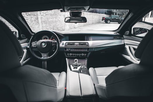 Experience the premium design inside a high-end automobile featuring leather seats and a sleek dashboard.