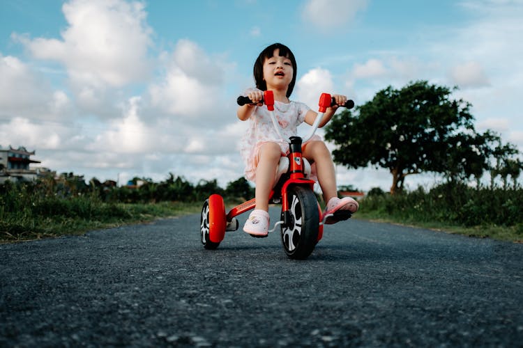 Girl Riding Small Bike