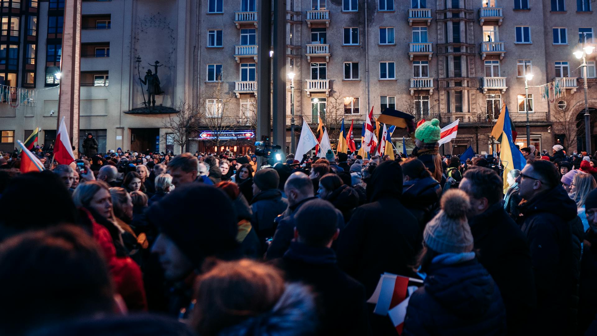 A Crowd of People in the Street Protesting against War