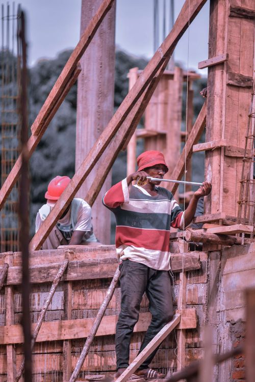 Construction workers building a framework on a construction site