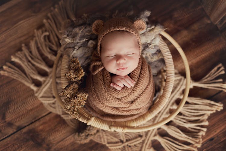 Newborn Baby Lying In Basket