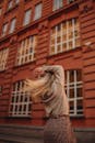 Woman Spinning in Front of a Building