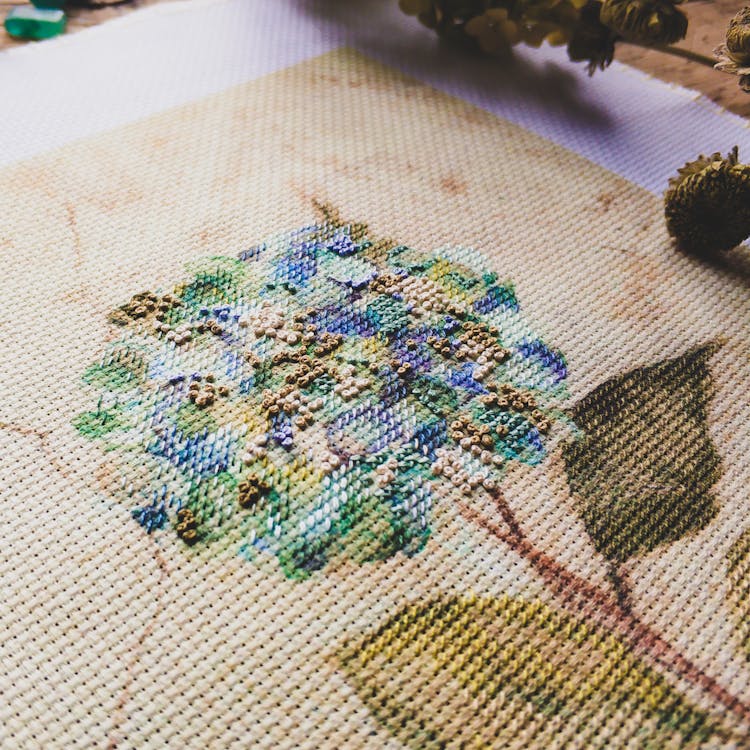 Close-up Of Cross Stitching On Canvas