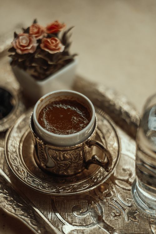 Free Authentic Turkish coffee in a traditional ornate cup and saucer served on an elegant tray, capturing cultural essence. Stock Photo