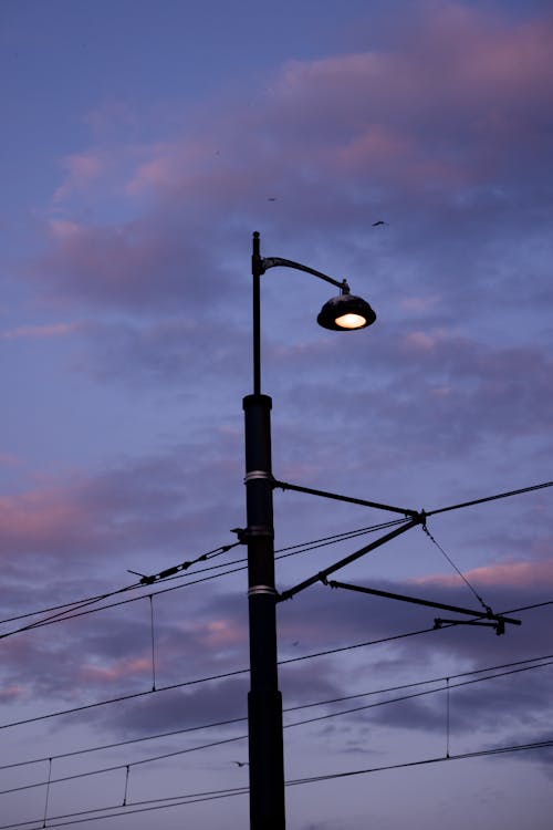 A Black Street Light Under Gray Clouds