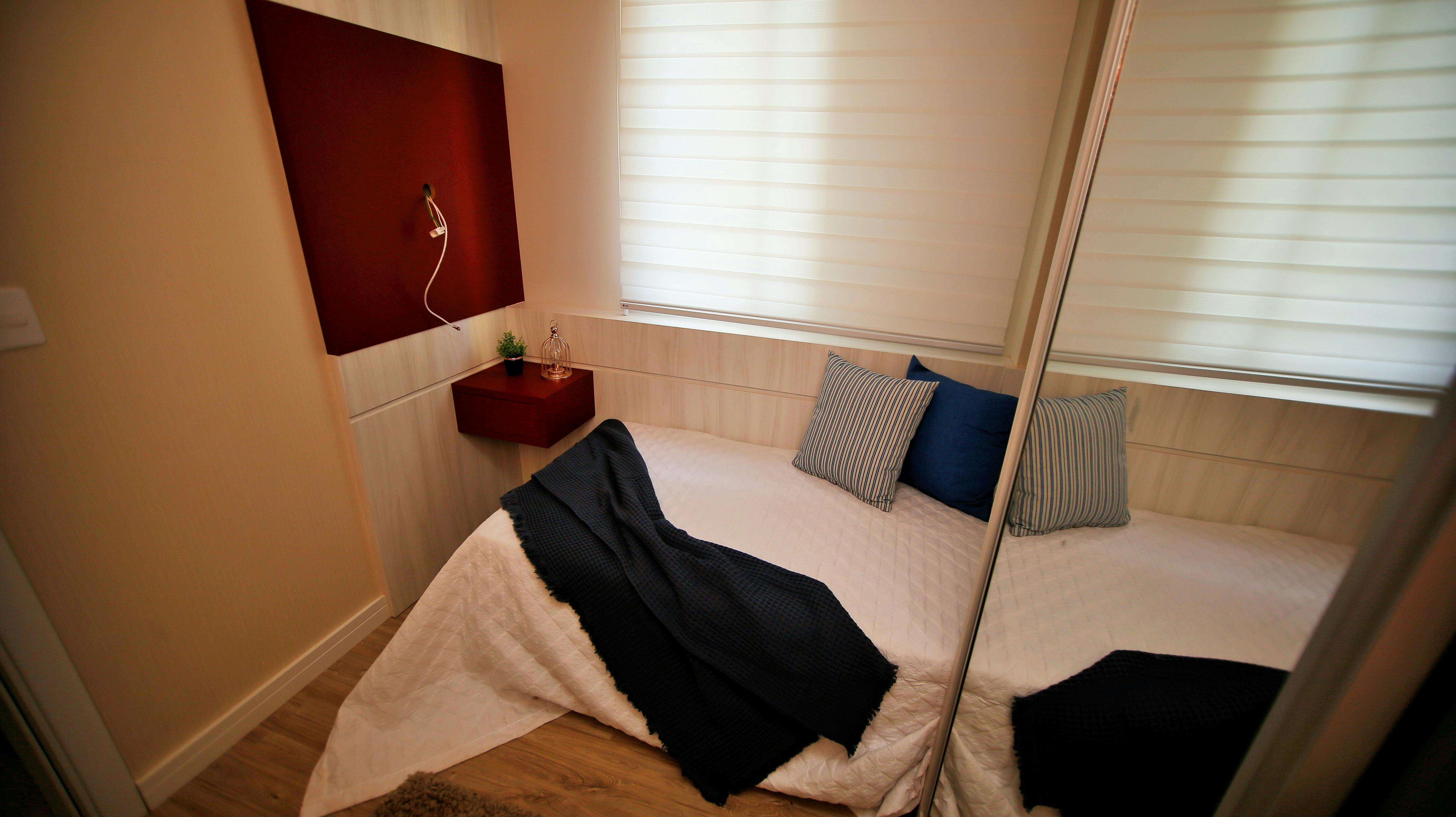 Couple sleeping on a compact foldable bed in a cozy space