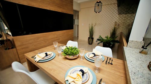 White Ceramic Plates on Brown Wooden Table