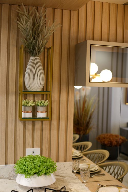 Free Stylish kitchen interior featuring decorative vases and plants on a wood backdrop. Stock Photo